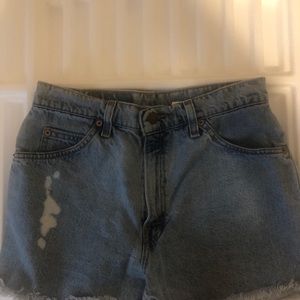Levi’s vintage 910 distressed high rise denim shorts.